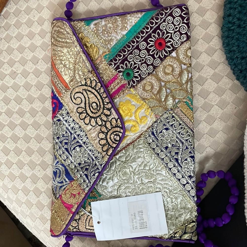 Purse Greece new lined in purple with zipper pocket/zipper closure Pom-Pom strap